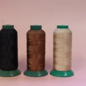 Nylon thread on roll in black, brown and blonde colours